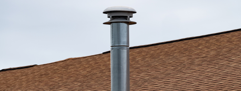 Metal Chimney On House Roof, Clean New Shiny Chimney Pipe On Blu