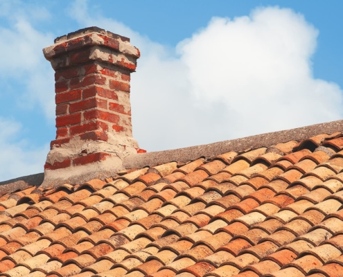 Chimney repair telford - Tile roof with brick chimney